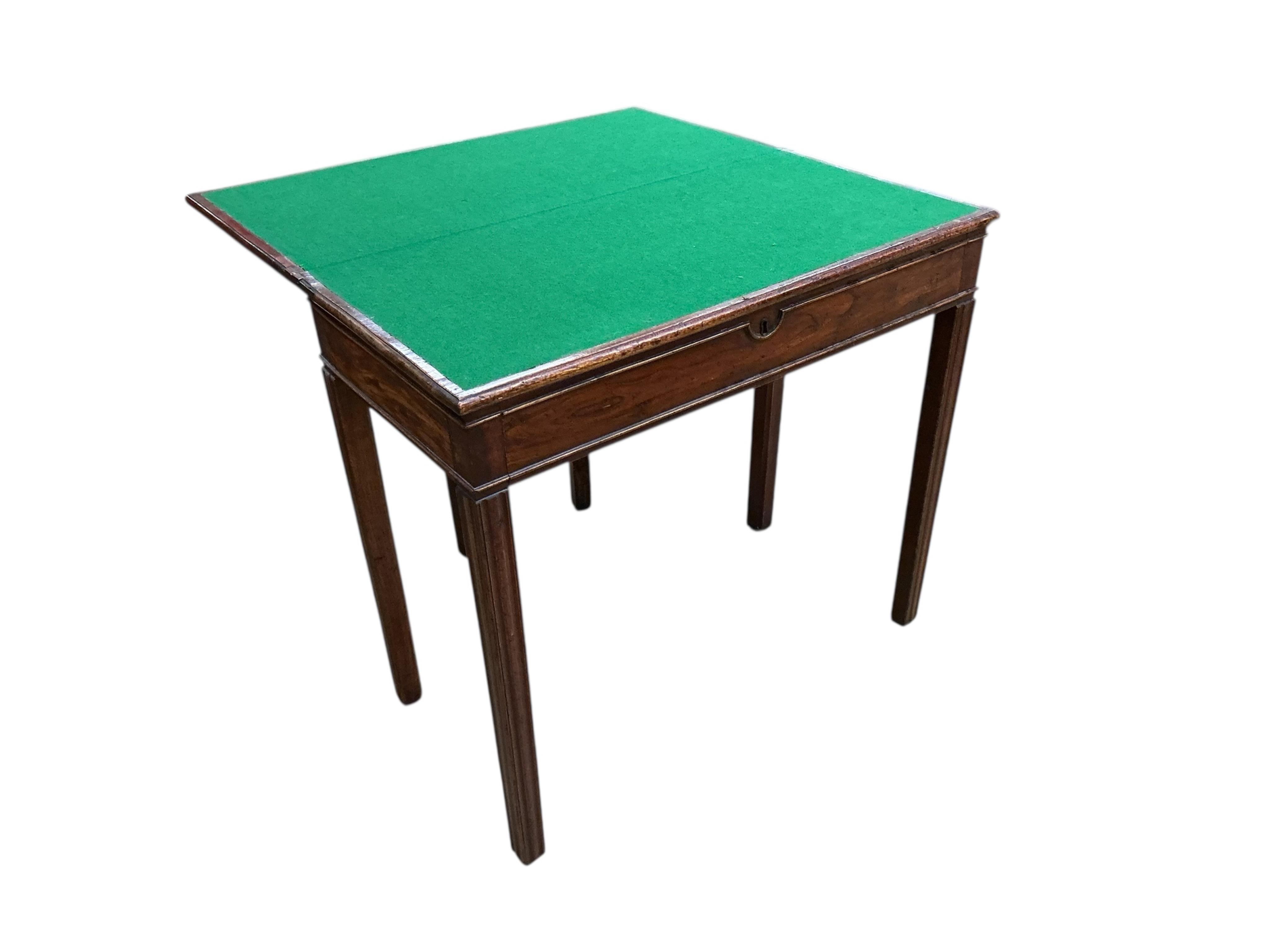 A George III rectangular mahogany and elm folding card table, width 84cm, depth 41cm, height 75cm